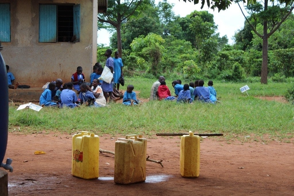 water on their heads daily routine women uganda 