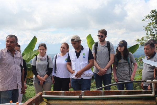  Image of 5 donors inspecting land