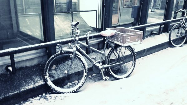 Bike on a snow sidewalk