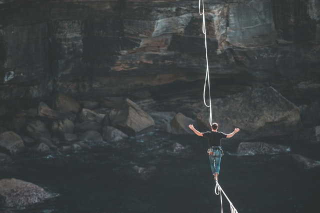 A man walking on a rope.