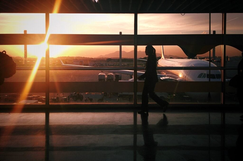 silhouette of person walking in airport