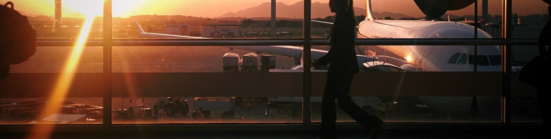 silhouette of person walking in airport