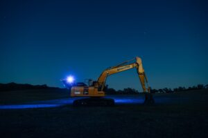 backhoe working at night