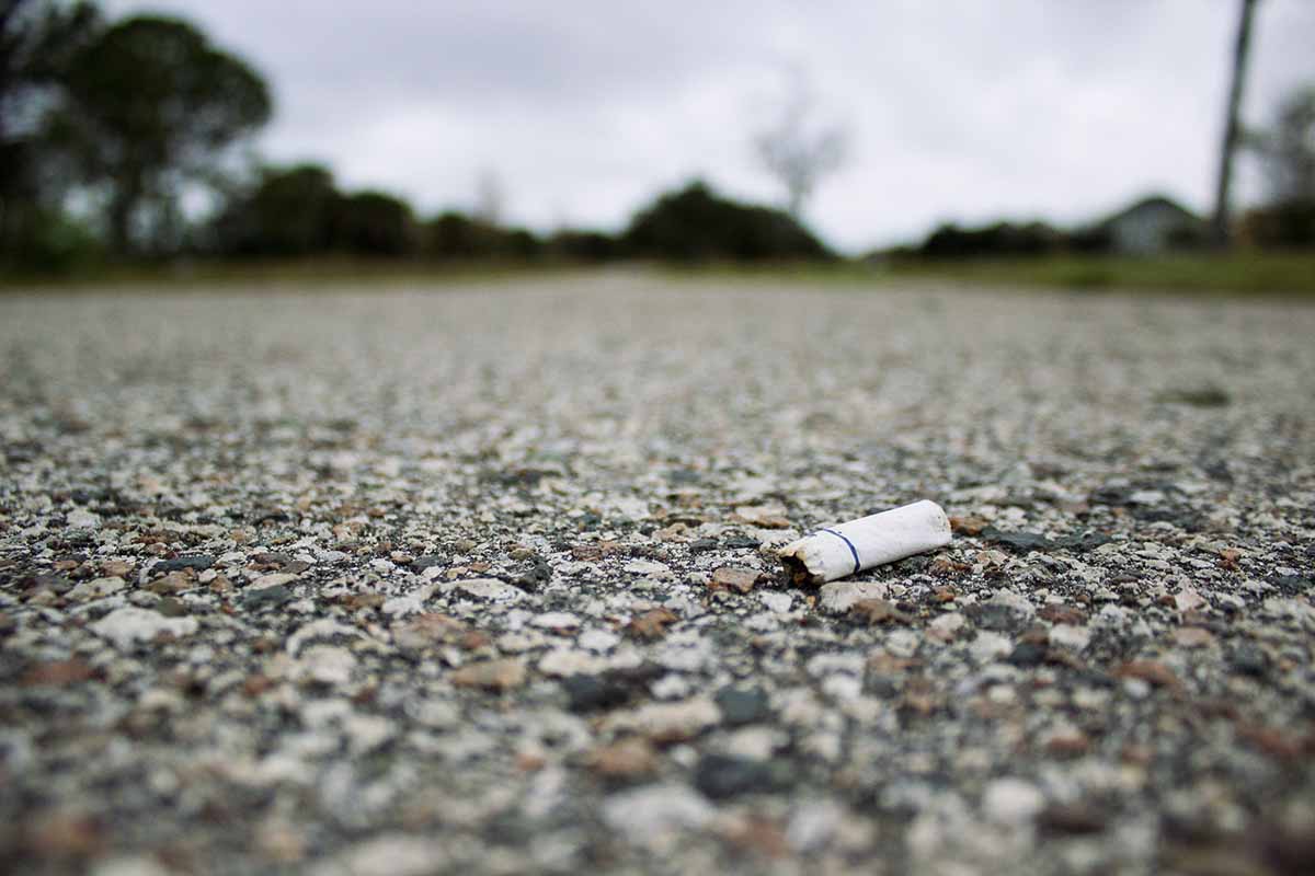 A cigarette butt on the ground