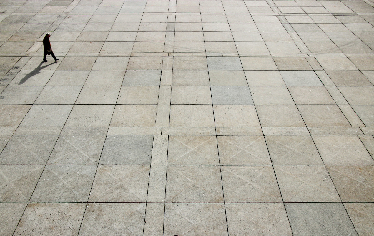 Paving lacking any vegetation or systems to promote water filtration. 