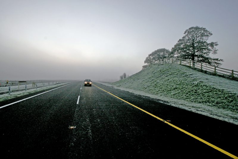 A road flanked by ice and snow