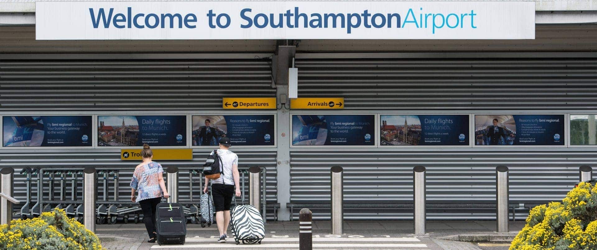 Image of two people arriving at Southampton airport