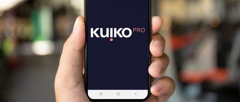 Image of a hand holding a mobile phone with Kuiko app